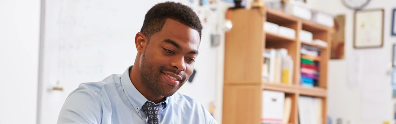 Education policy professional working at his desk